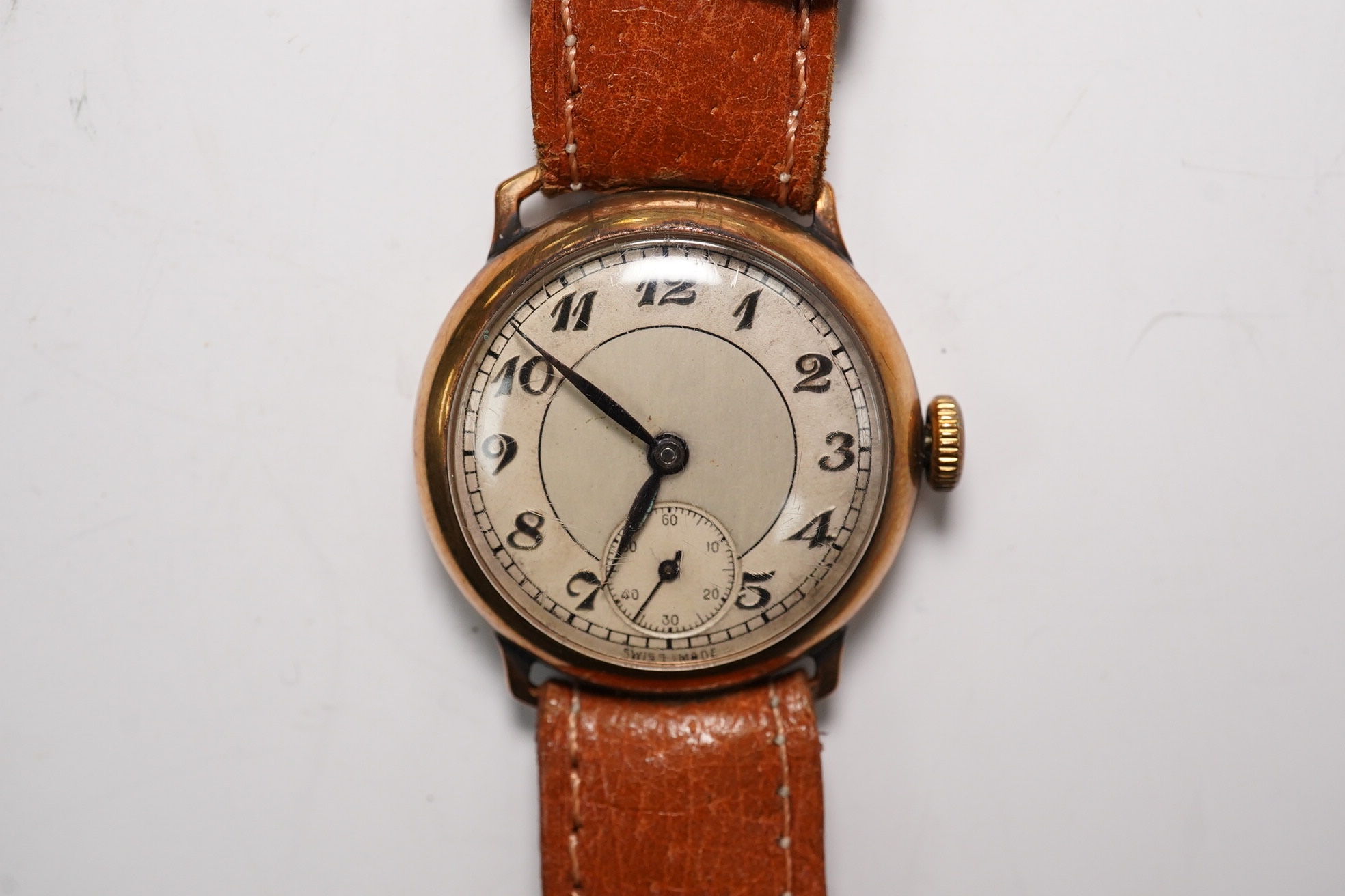 A gentleman's 1930's 9ct gold manual wind wrist watch, with Arabic dial and subsidiary seconds, case diameter 29mm, on a later leather strap. Condition - poor